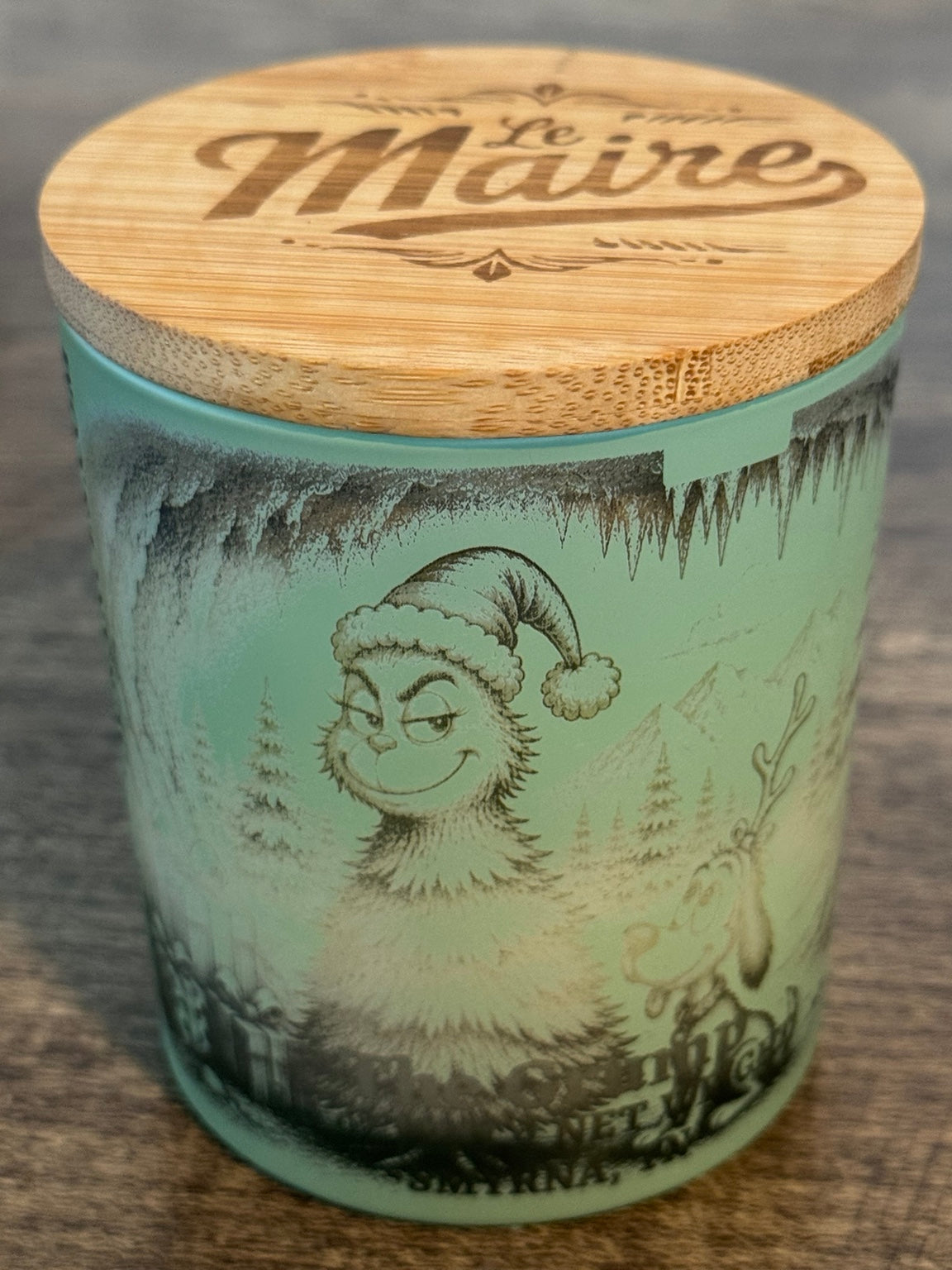 The Grump handmade fir soy candle angled view with Le Maire wood lid